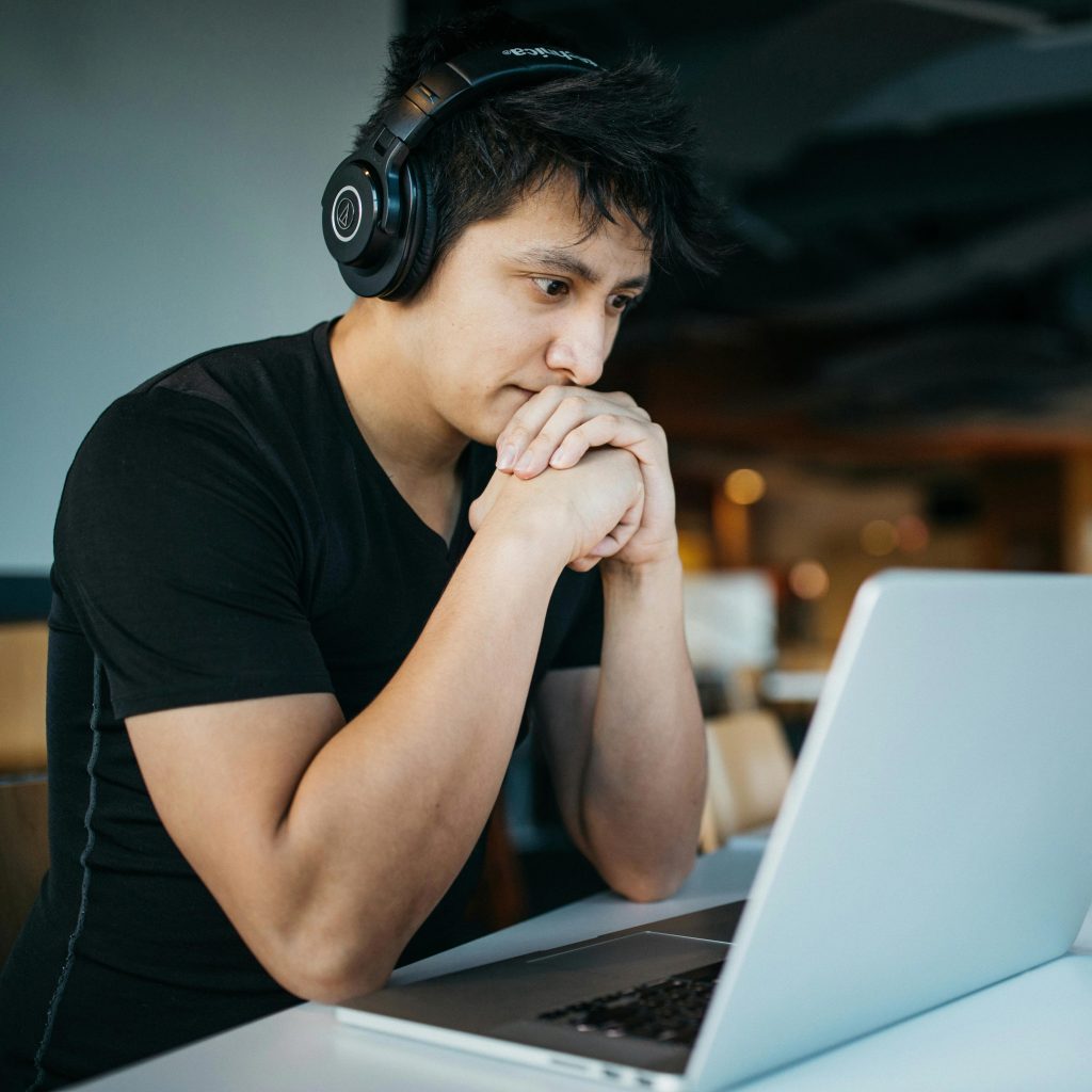 an adult learner staring at a laptop screen